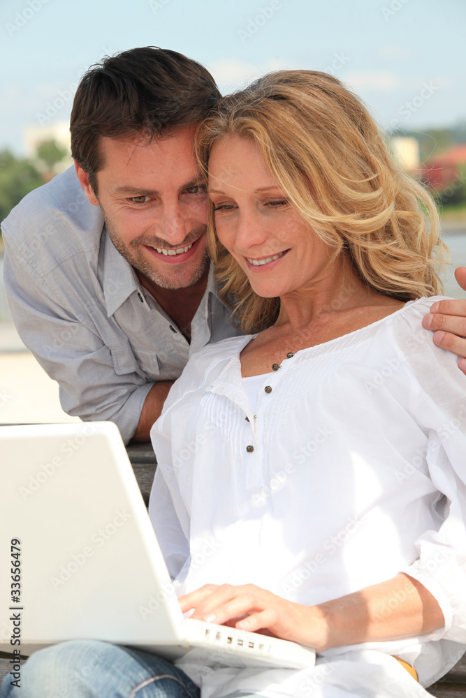 portrait of a couple with laptop portrait of a couple with laptop