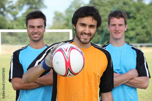 Three football team mates