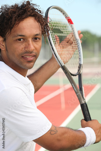 Tennis player on hard court © auremar