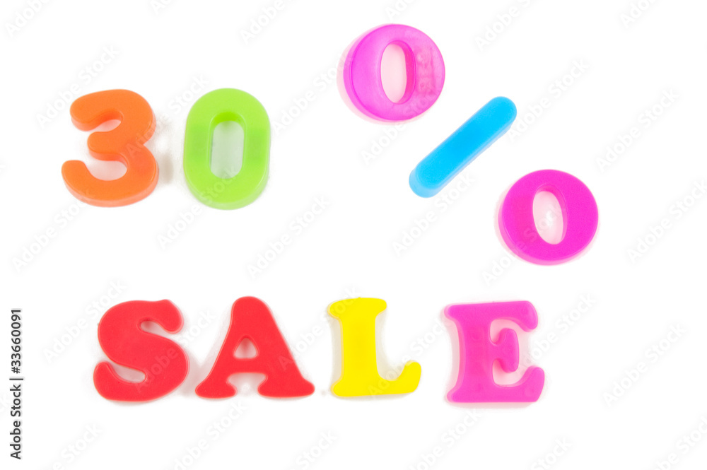 30% sale written in fridge magnets on white background 30% sale written in fridge magnets on white background