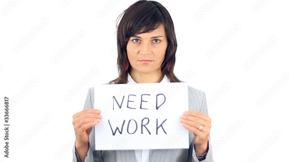 Unhappy businesswoman holding sign NEED WORK, isolated Unhappy businesswoman holding sign NEED WORK, isolated