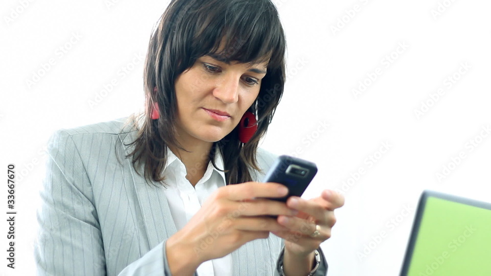Businesswoman texting, sending sms during work Businesswoman texting, sending sms during work