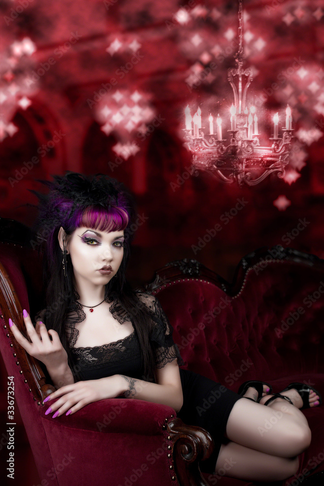Fototapeta premium Come into my Lair - Vampire on red Velvet Couch