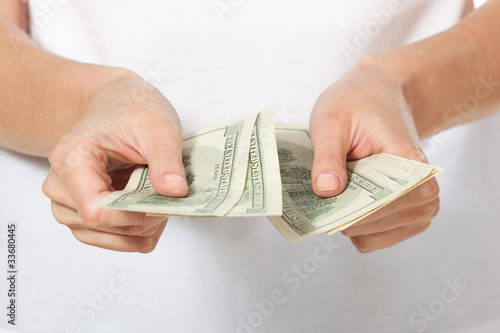 Female hands counting money, shallow deep of field