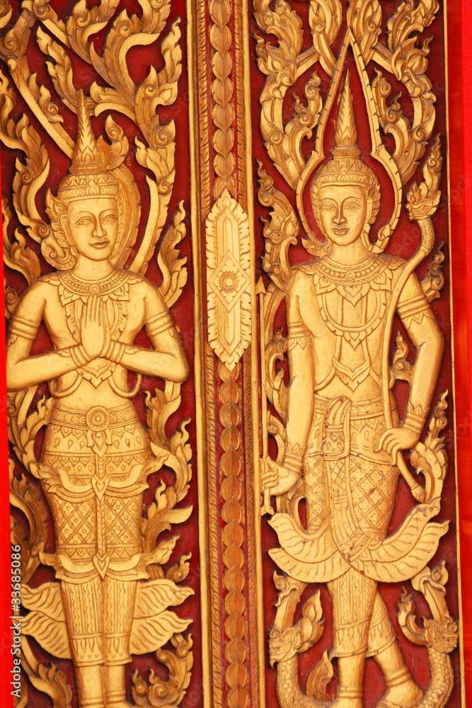 Sculpture  door in temple in Thailand.