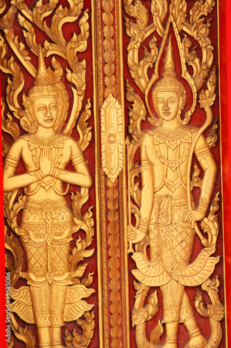 Sculpture door in temple in Thailand.