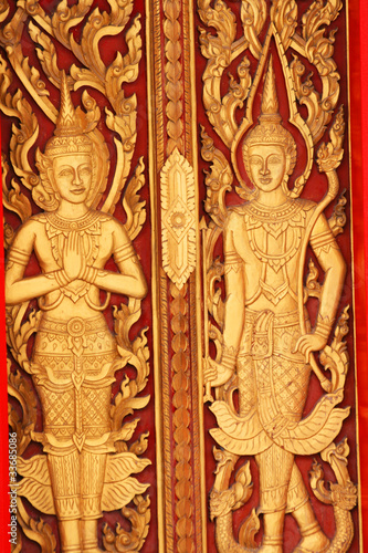 Sculpture  door in temple in Thailand. © Charlie Milsom