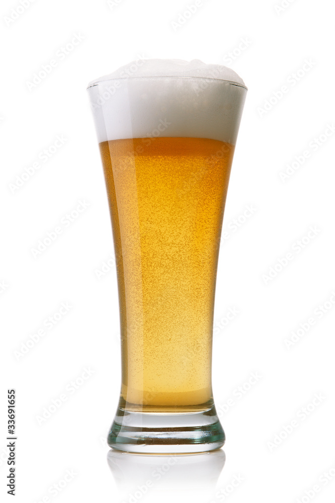 Beer into glass isolated on white Beer into glass isolated on white