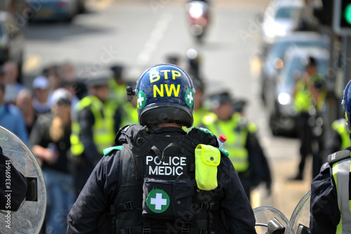 Rear view of police officer at EDL demonstration