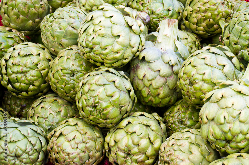 Fototapeta premium Green artichokes on display