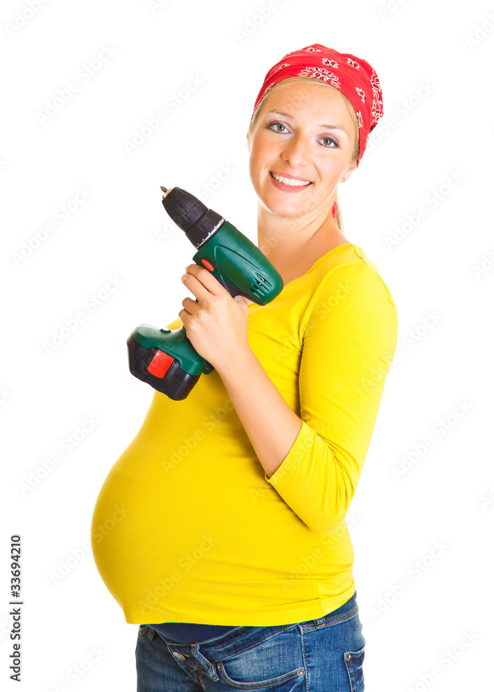 Pregnant woman with powertools isolated on white Pregnant woman with powertools isolated on white