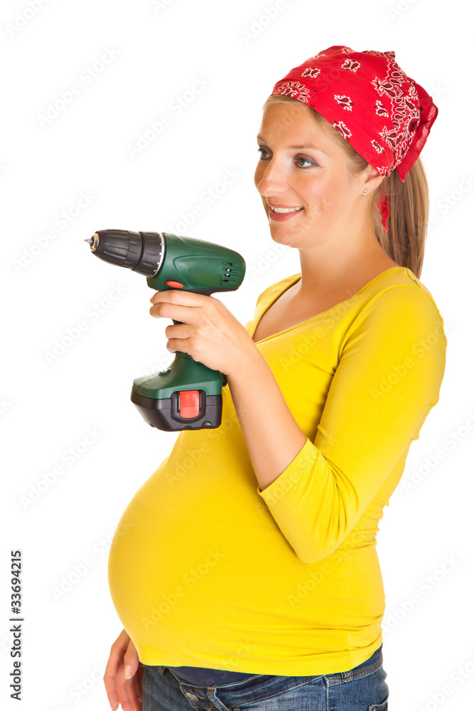Pregnant woman with powertools isolated on white Pregnant woman with powertools isolated on white