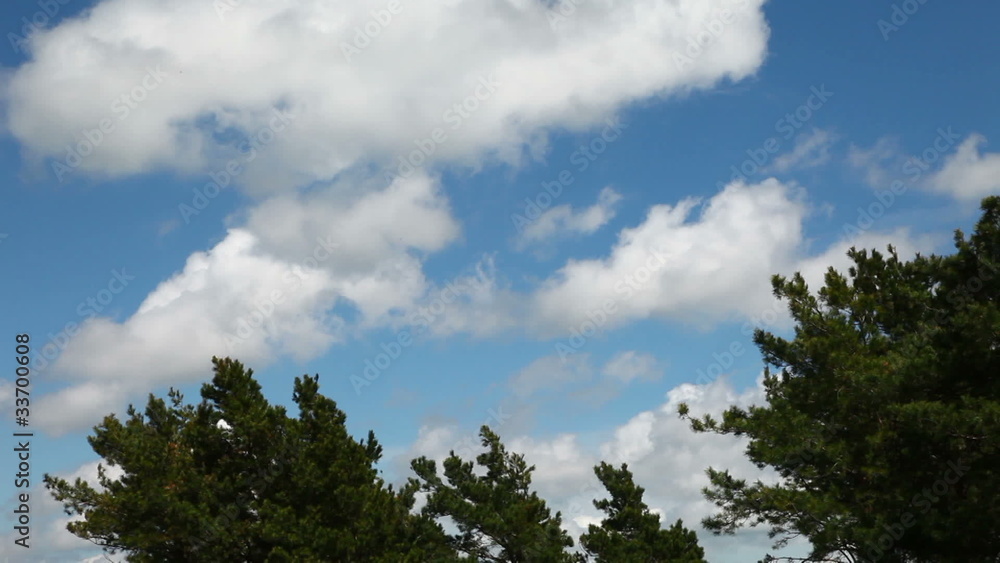 Time lapse clip of white fluffy clouds over blue sky Time lapse clip of white fluffy clouds over blue sky