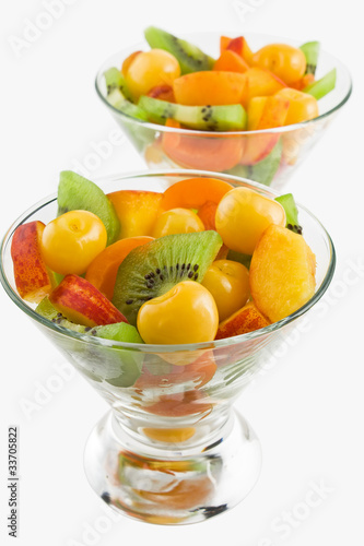 Delicious mix of different summer fruits salad