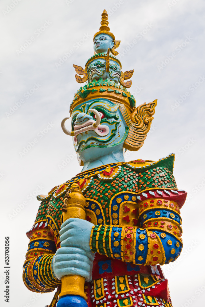 Guardian statue at the temple in Thailand .