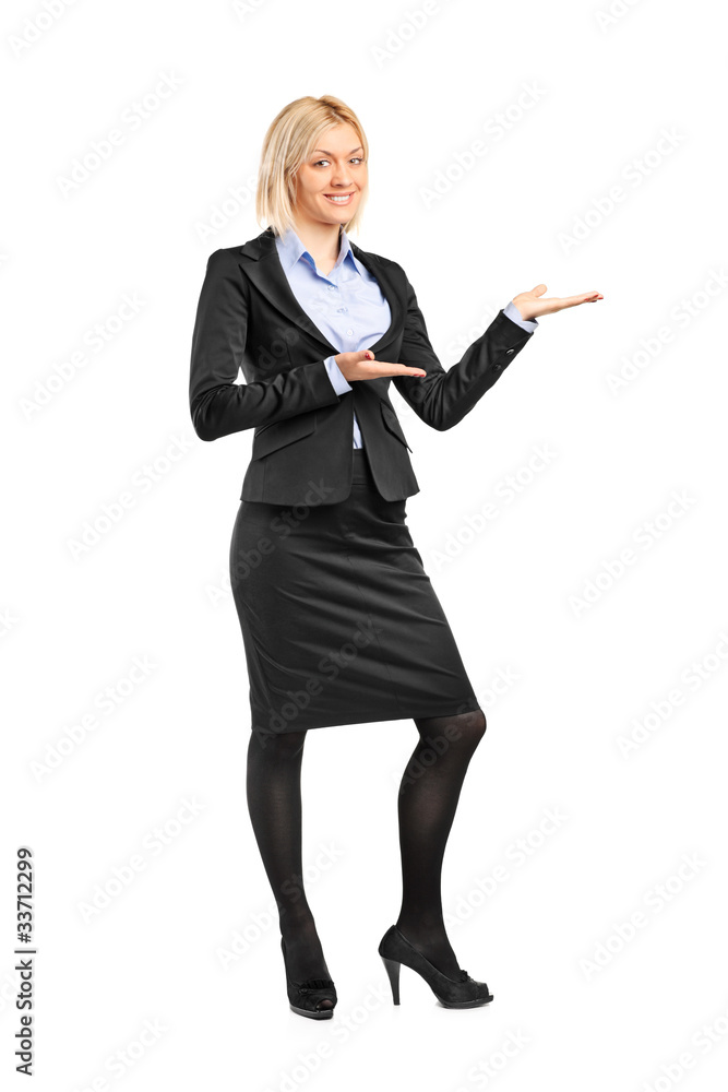 Portrait of a female in suit gesturing welcome Portrait of a female in suit gesturing welcome