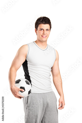 A male athlete holding a football © Ljupco Smokovski