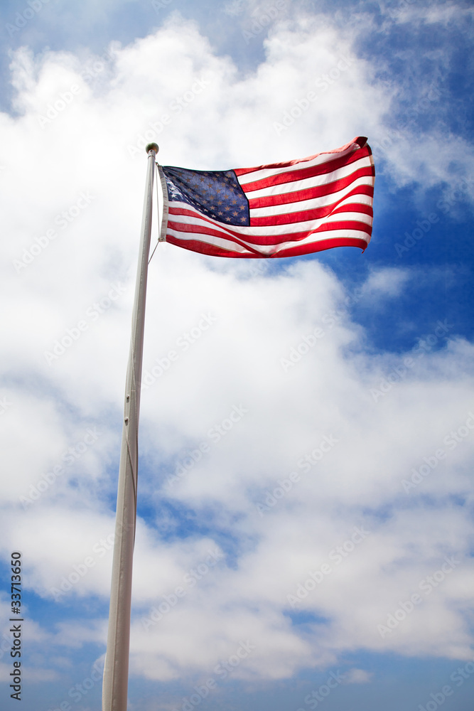 American flag against blue sky American flag against blue sky