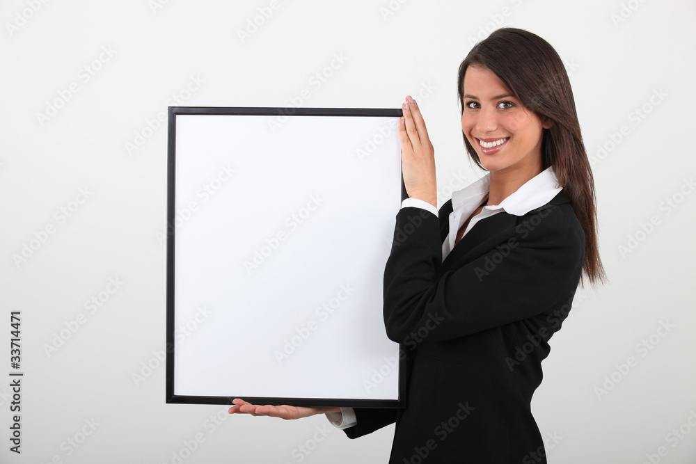 Attractive businesswoman with picture frame Attractive businesswoman with picture frame