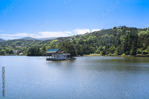 pavilion in the lake at summer