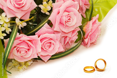 Wedding concept with roses and rings