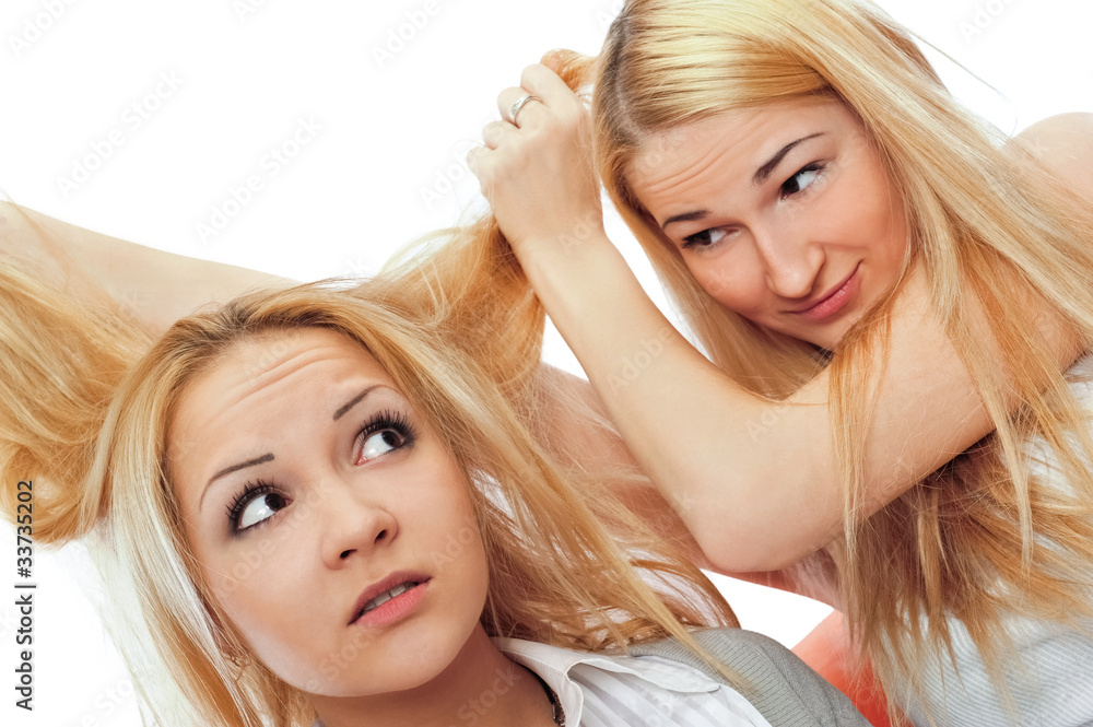 Naklejka premium Two women sitting on couch and playing with each other