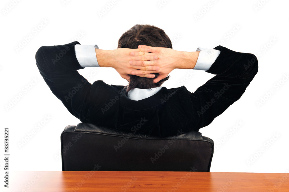 Closeup portrait of young businessman from the back. Sitting wit Closeup portrait of young businessman from the back. Sitting wit