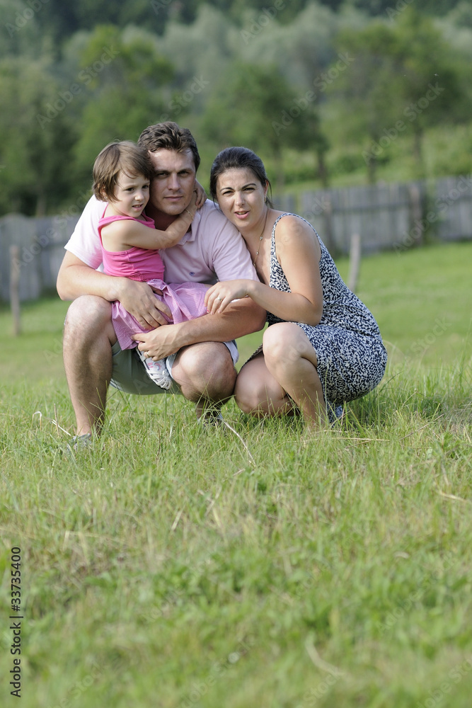 Fototapeta premium beautiful family posing in nature