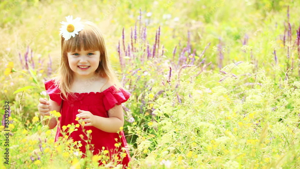 Girl smelling a yellow flower Girl smelling a yellow flower