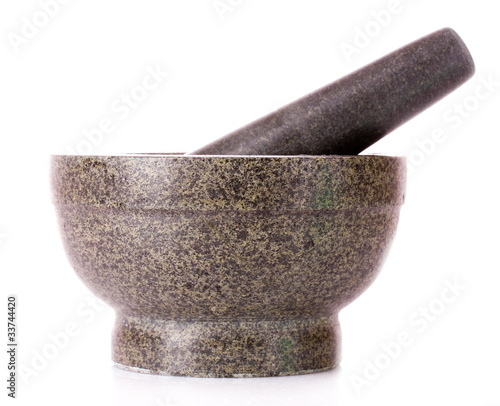 stone pestle and mortar over a white background