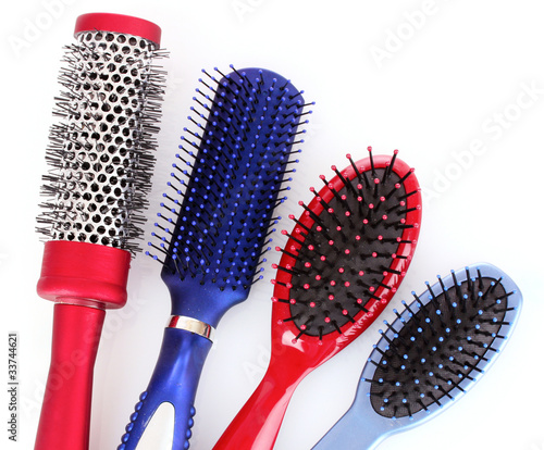 Different types of hairbrushes isolated on white