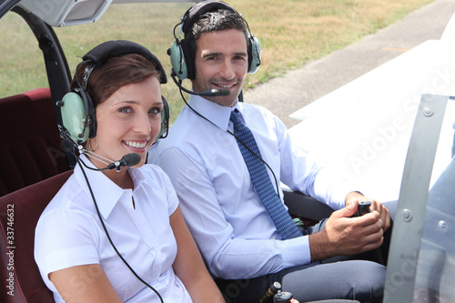 Man and woman in the cockpit of a light aircraft