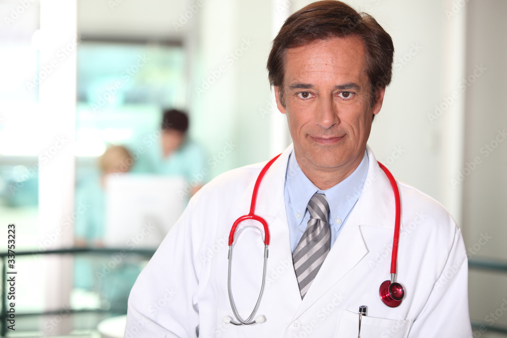 Doctor in a white coat and stethoscope Doctor in a white coat and stethoscope
