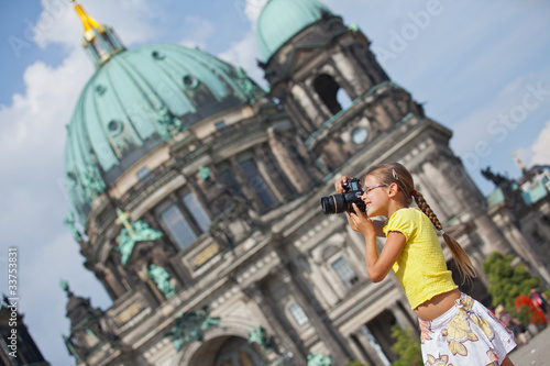 Canvas Print young girl with photo camera