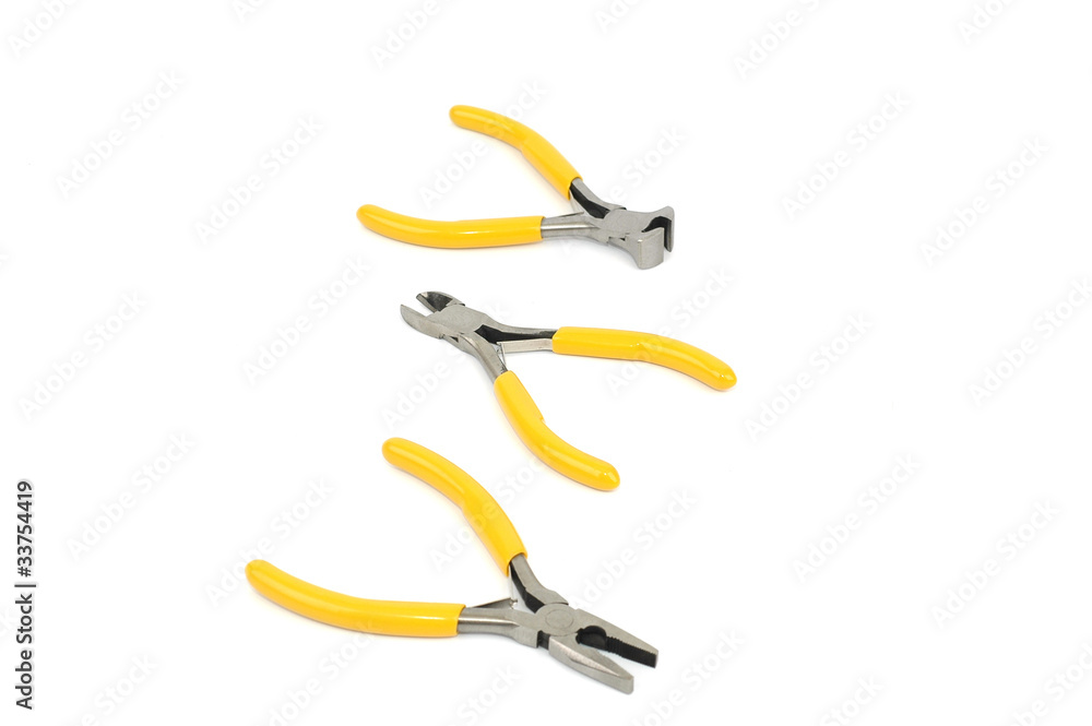 pliers arranged on white background pliers arranged on white background