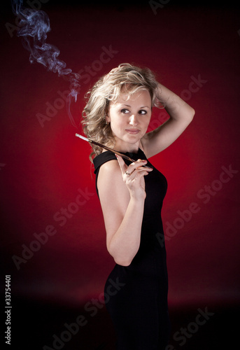 Tableau sur toile Beautiful woman with cigarette holder
