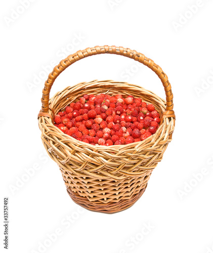 ripe wild strawberry in a wicker basket