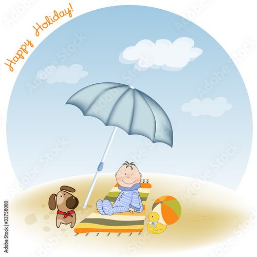 a little boy sits on the beach with his dog