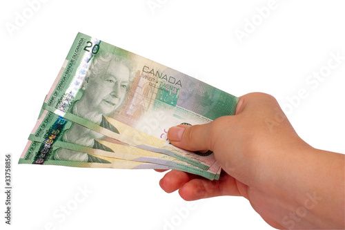 Female hand holding Canadian money