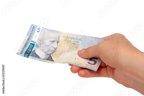 Female hand holding Canadian money