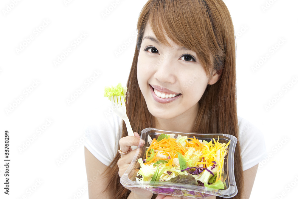 young Woman smiling and holding vegetable and salad young Woman smiling and holding vegetable and salad