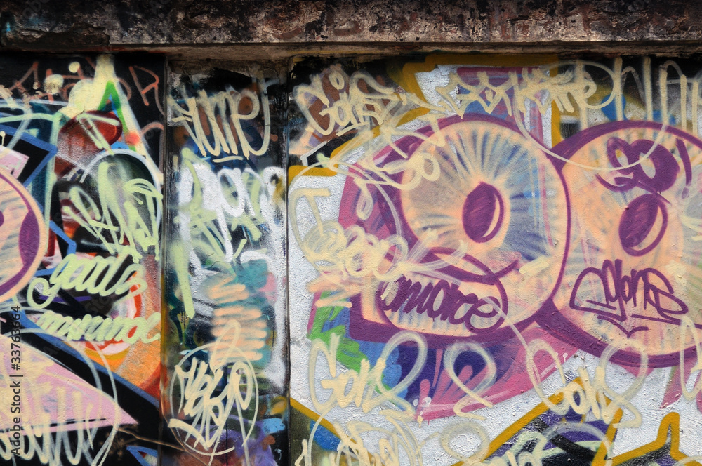 grunge urban wall with messy graffiti tags
