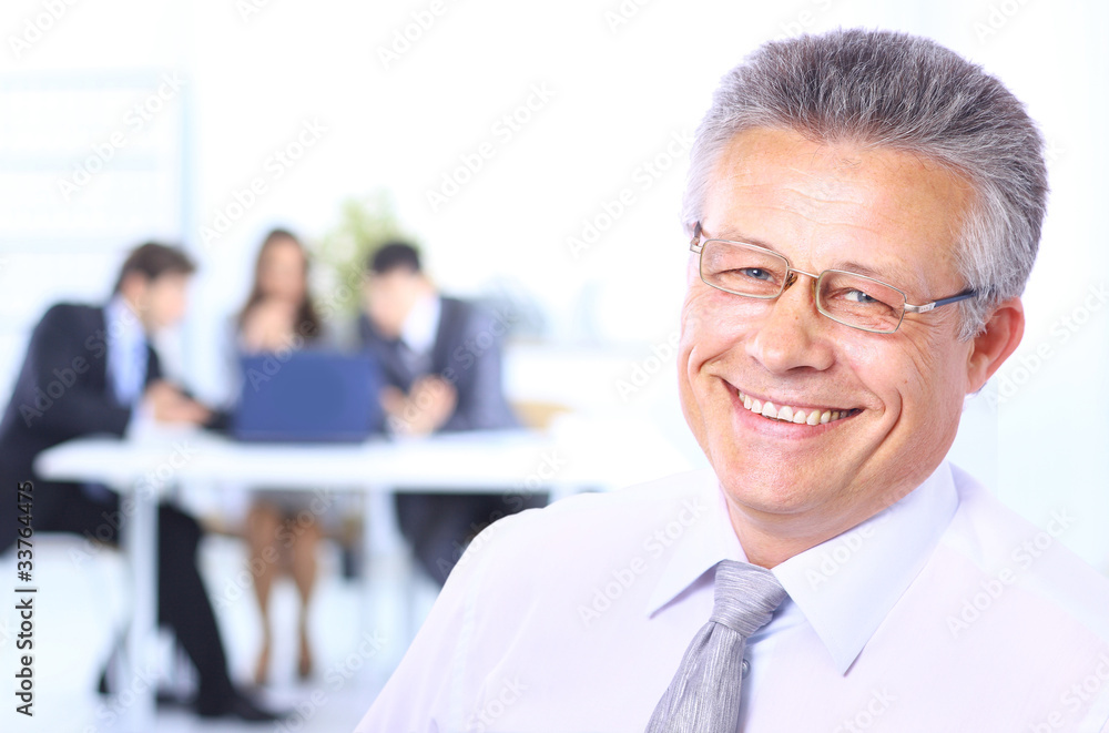 Portrait of a confident senior business man at meeting Portrait of a confident senior business man at meeting