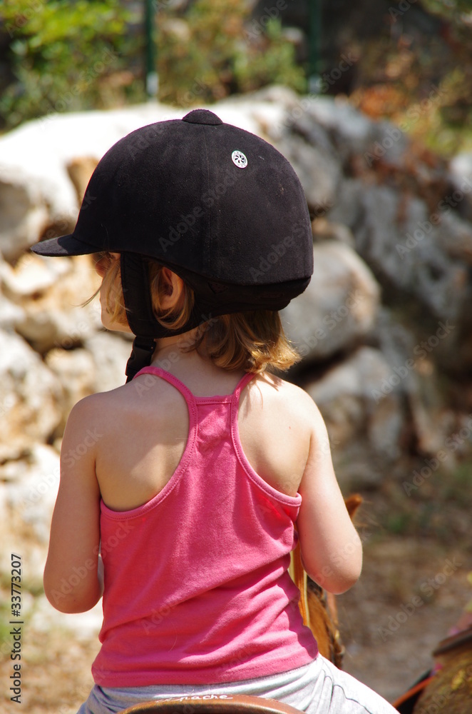 Obraz premium enfant sur un poney