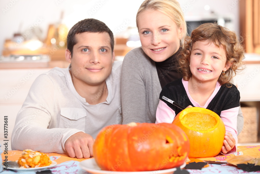 Family carving pumpkins together
