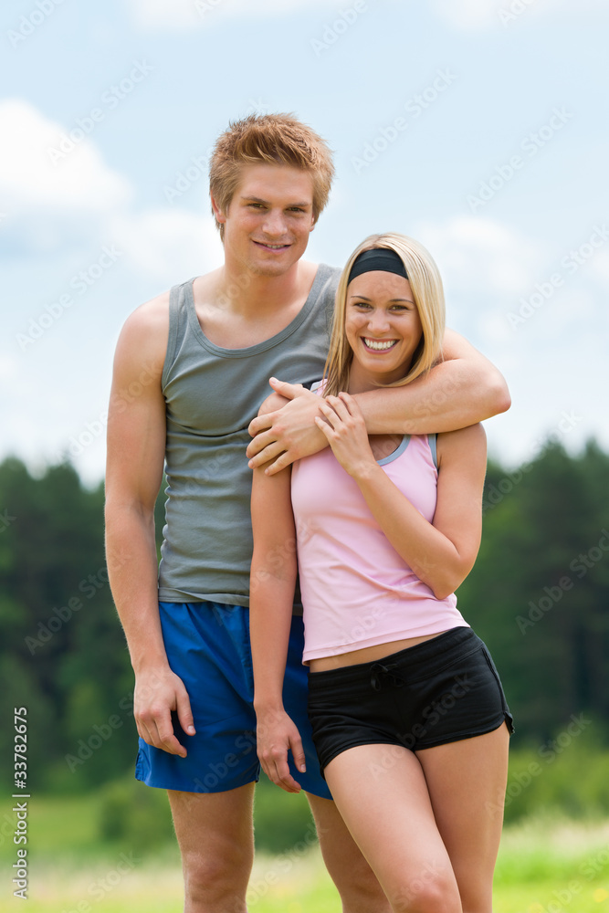 Sportive young couple happy posing in coutryside Sportive young couple happy posing in coutryside