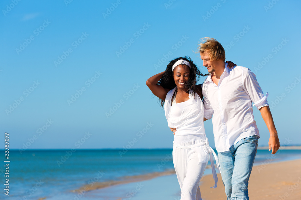 Happy couple walking and running on beach Happy couple walking and running on beach