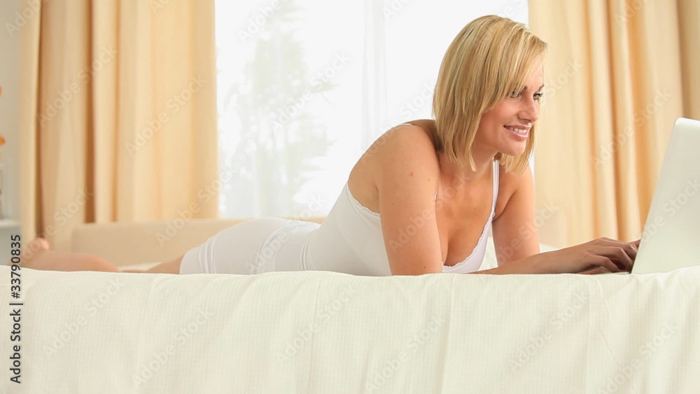 Young woman typing on her laptop Young woman typing on her laptop