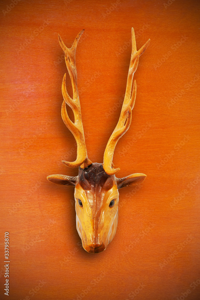 Fototapeta premium The deer wood vintage object on wood background