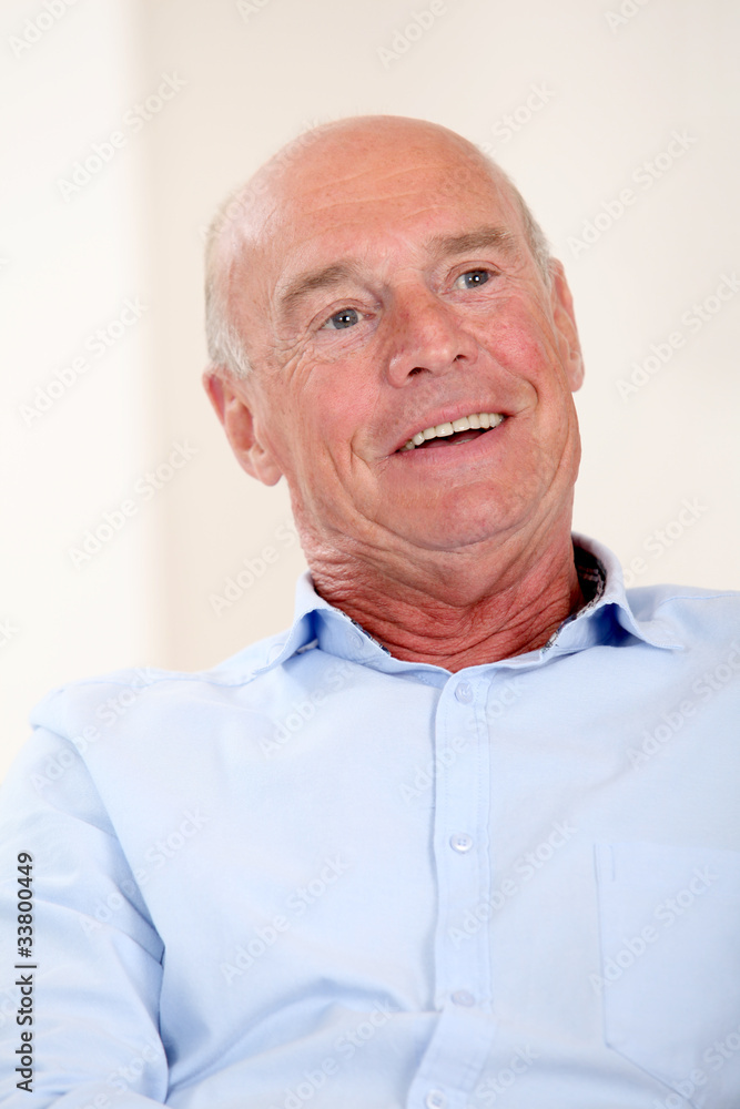 Fototapeta premium Portrait of senior man in blue shirt